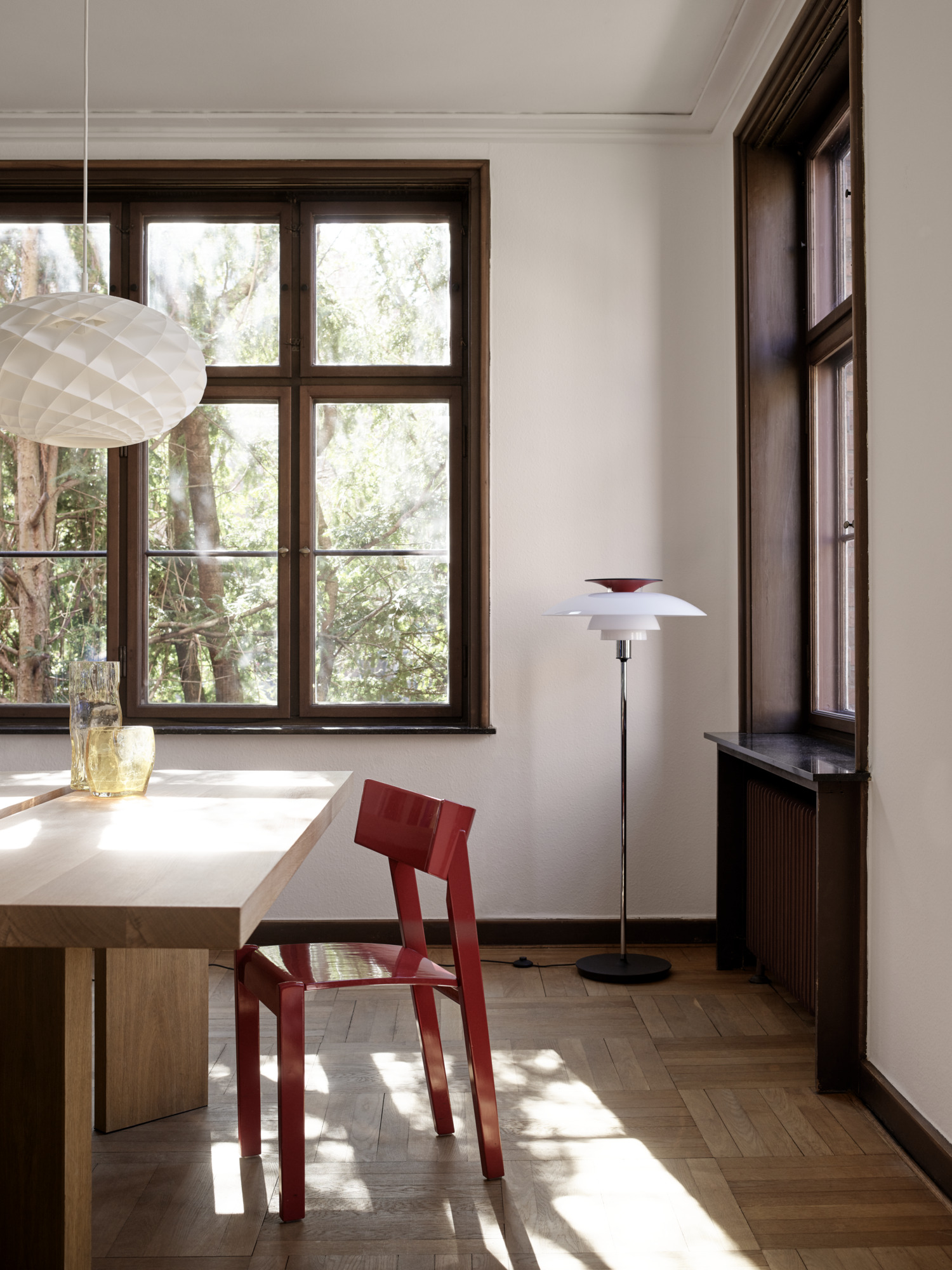 PH 80 floor lamp unlit in white and chrome with an elegant design in a sunlit room, © 2025 Louis Poulsen.
